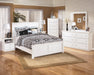 Bostwick Shoals Queen Panel Bed with Mirrored Dresser and Chest Homeline Furniture