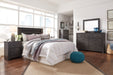 Brinxton King/California King Panel Headboard with Mirrored Dresser Homeline Furniture