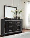 Kaydell King Upholstered Panel Bed with Mirrored Dresser Homeline Furniture